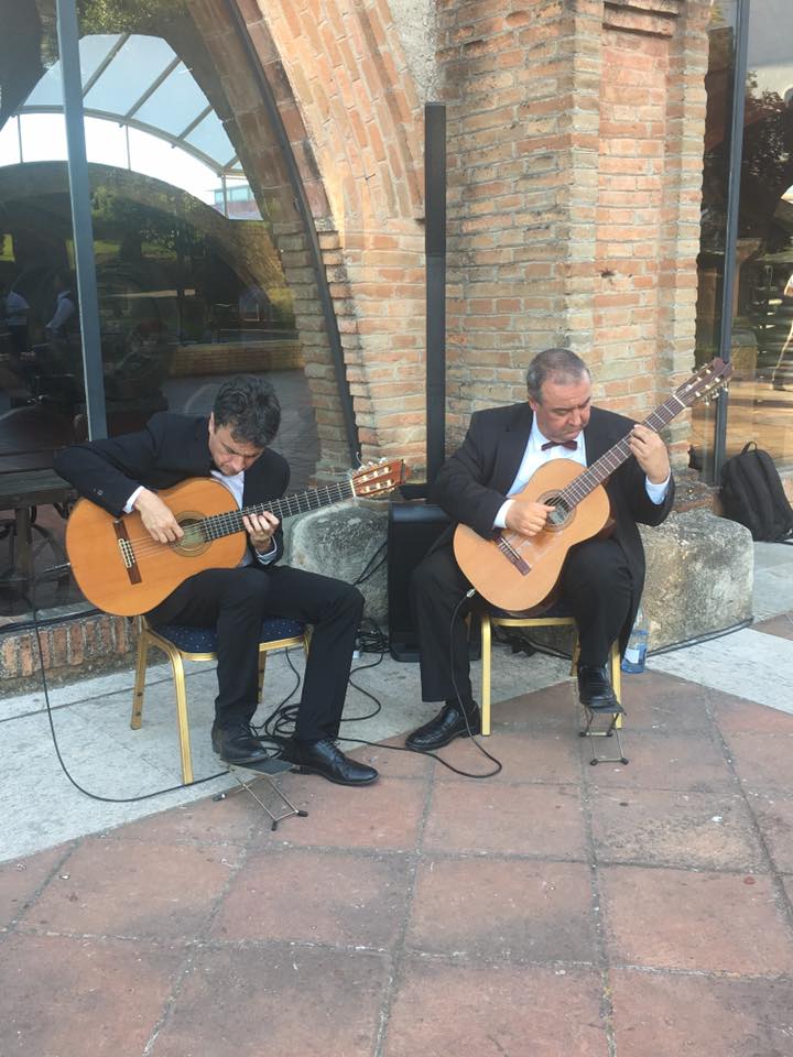 Guys playing guitars - mti events