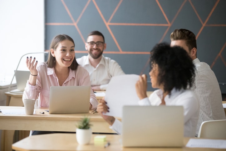 Employees-chatting-modern-work-space