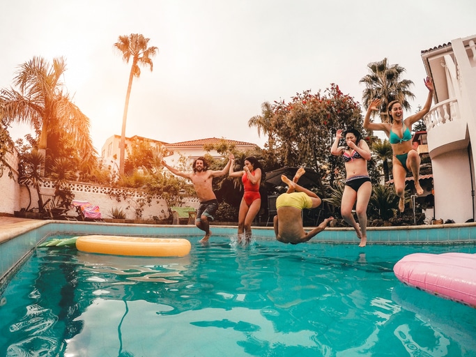 People-jumping-into-pool