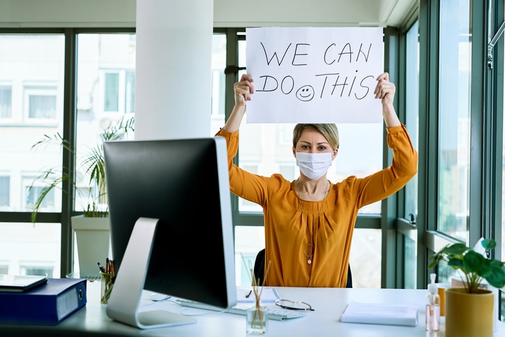 Woman-with-mask-inspirational-sign
