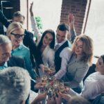 This Is A Photo Of A Group Of Coworkers Celebrating.