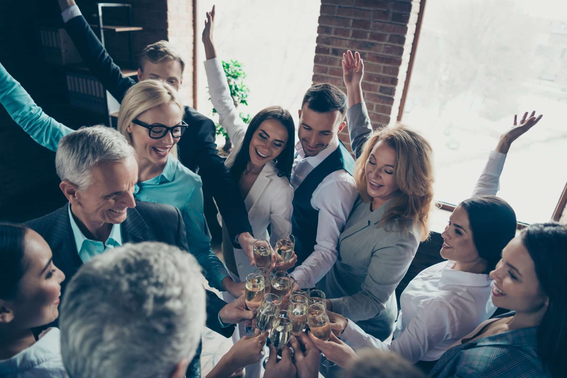 This is a photo of a group of coworkers celebrating.